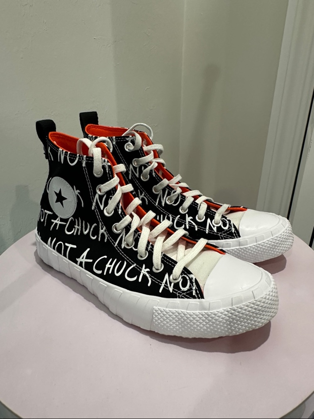 Converse Black and White High-Top Sneakers with Orange Accents